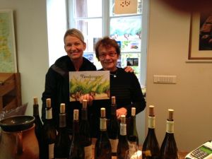With hostess Brigitte at "degustation" (wine tasting). Her son and daughter-in-law wrote the book that we're holding
